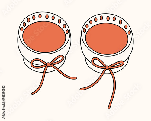 Two baby bonnets with orange ribbons and decorative circles infant hat headwear