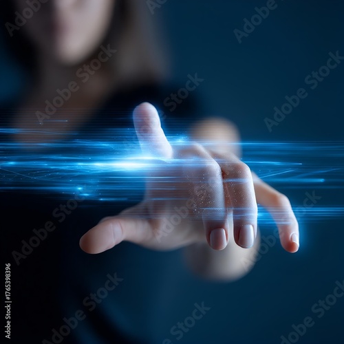 close-up of woman’s hand using holographic digital interface with futuristic blue light
