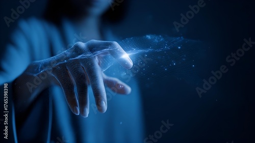 close-up of woman’s hand using holographic digital interface with futuristic blue light