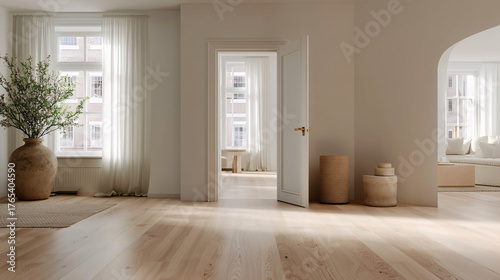 Empty hall with oak floor and open door to another space — light minimalism and architectural depth.