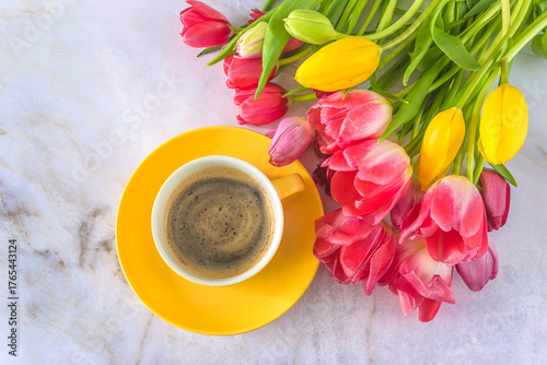 Happy Valentines day concept; top view for cup of coffee and bunch of tulips on a marbre background