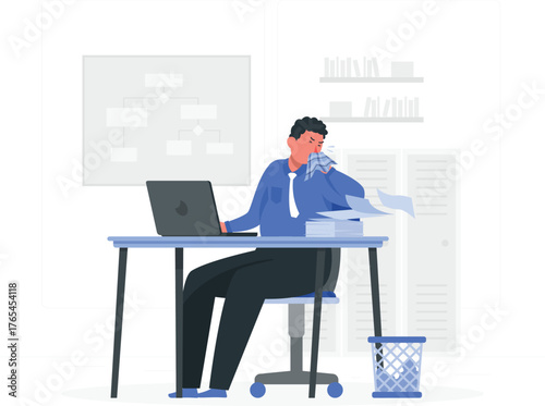 Man at a desk crying and wiping his eyes with a tissue office