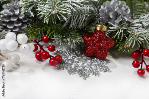 Christmas card with fir branches and Christmas decorations