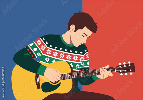 Young man enjoying a festive holiday melody, playing his acoustic guitar in a cozy Christmas sweater