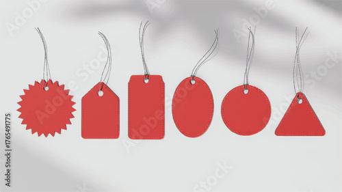Six Red Blank Tags of Various Shapes Hanging on a White Background empty