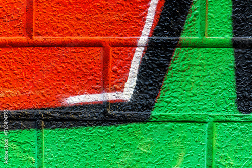 Art under ground. Beautiful street art graffiti background. The brick wall is decorated with abstract drawings house paint. Modern style urban culture of street youth. Abstract picture on wall