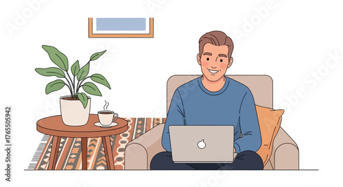 Happy man working on laptop comfortably at home, enjoying coffee.