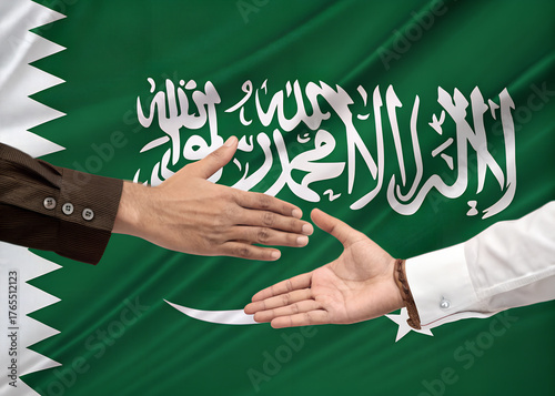 Saudi Arabia Flag with Handshake Symbolizing Partnership and Agreement
