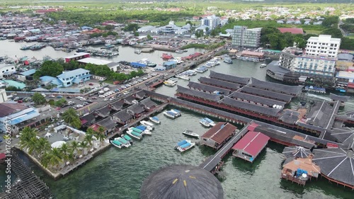 Aerial footage view of commercial pier and fisherman village at Semporna, a city on east coast of Sabah in Malaysia, Tawau District, Borneo island