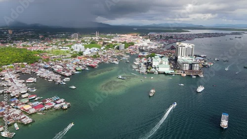 Aerial footage view of commercial pier and fisherman village at Semporna, a city on east coast of Sabah in Malaysia, Tawau District, Borneo island
