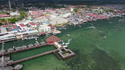 Aerial footage view of commercial pier and fisherman village at Semporna, a city on east coast of Sabah in Malaysia, Tawau District, Borneo island