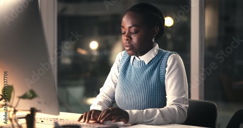 Business, black woman and computer in office at night for editor feedback, information and article post. Person, typing and pc for proofreading news, update draft and working late for publication