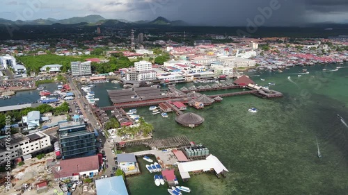Aerial footage view of commercial pier and fisherman village at Semporna, a city on east coast of Sabah in Malaysia, Tawau District, Borneo island