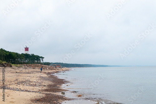 lighthouse by the sea in the fog