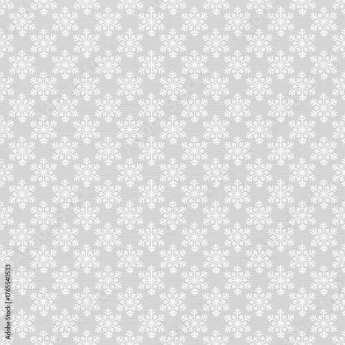 Seamless repeating snowflake pattern on gray background. Festive winter and Christmas texture ideal for wrapping paper, textiles, gift tags, holiday backgrounds, greeting cards, and seasonal designs.