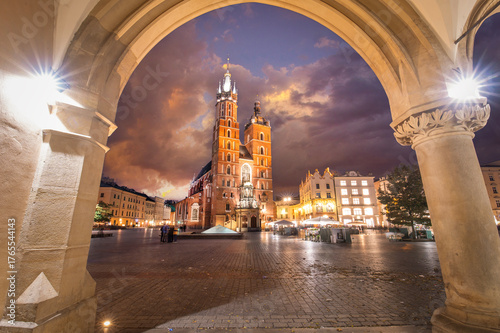 St Mary's Basilica (Mariacki Church) in the Old Town of Krakow (Cracow), Poland. Illuminated on The Main Market Square at night after sunset