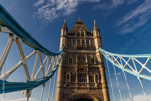 Symmetrical view of Tower Bridge tower and suspension spans
