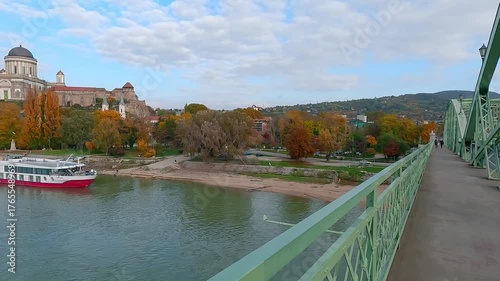Nice afternoon view of St Ignatius Church and Basilica of Esztergom on background. Beautiful autumn cityscape of Esztergom town on the shore od Danube river, Hungary. 4K video (Ultra High Definition).