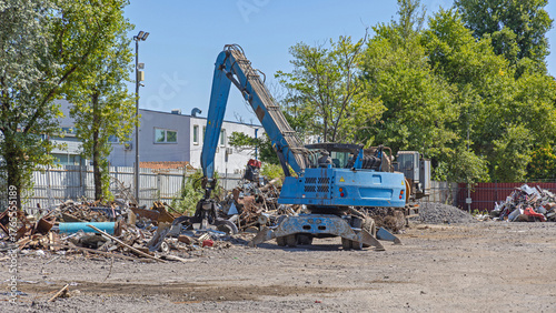 Photos Crane Loader Machine Grappling Hook at Metal Wrecking Yard Recycling