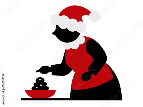 Woman in santa hat making dessert in a red bowl