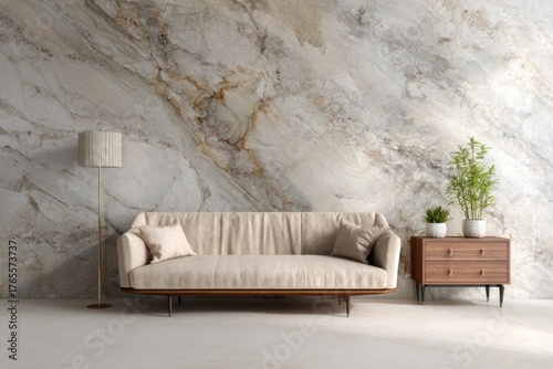 Elegant living room with neutral sofa, floor lamp, and marble wall.