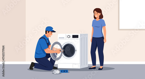 A professional repairman in uniform fixing a washing machine for a female customer in her home.