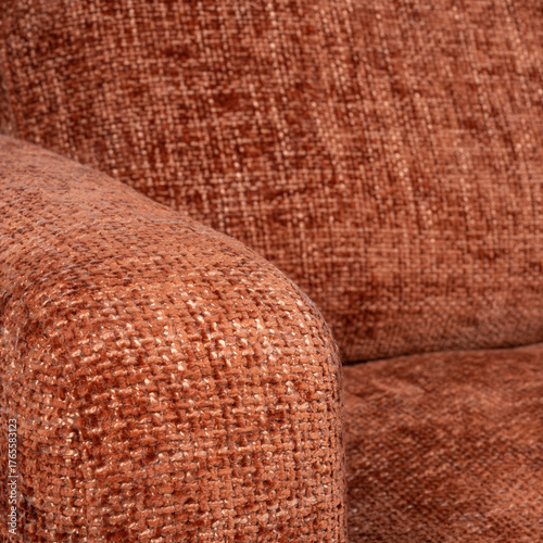 Detailed close-up of terracotta chenille sofa upholstery highlighting fabric weave, warm earth tones, and soft texture. Perfect for interior design, textile, or furniture craftsmanship concepts