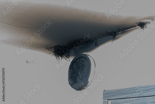 Burnt out LED lamp. A lampshade lamp on the wall after a fire. Spontaneous combustion and fire in a residential building. Indoor