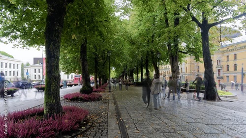People walking downtown. Pedestrians on a rainy day. Time Lapse. Oslo, Norway.