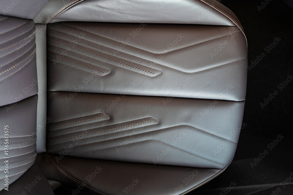 Obraz premium New, modern car black, quilted leather front passenger seat.Top down view, no people