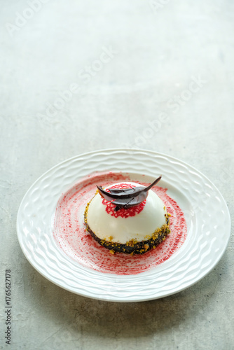 Tablou pe pânză An exquisite dessert elegantly presented on a plate, featuring a delectable cake