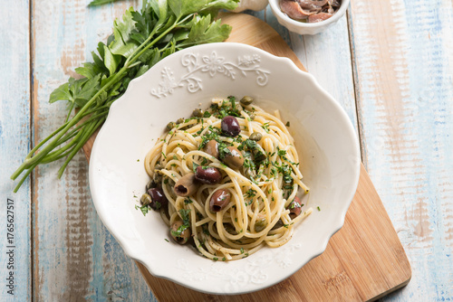 spaghetti with anchovy capers  black olives and parsley