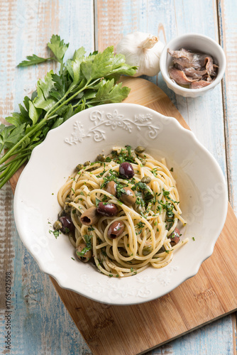 spaghetti with anchovy capers  black olives and parsley