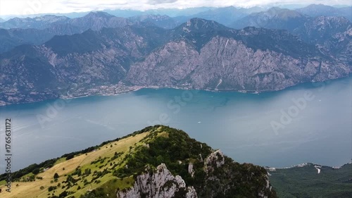 Drone flight over calm alpine lake in Italy
