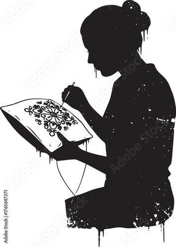 Silhouette of a woman embroidering a pillow with intricate flora