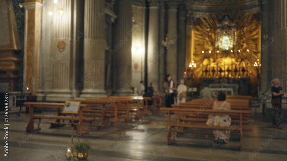 Fototapeta premium Blurred church interior with soft shallow bokeh and defocused altar, pews and columns in warm light; background backdrop copyspace calm.