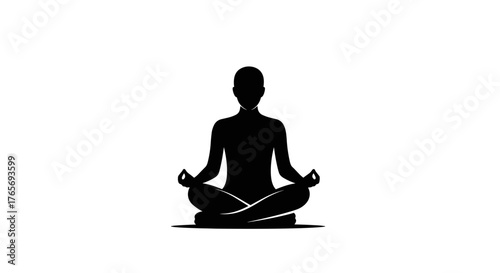 Silhouette of a person meditating in a lotus position.