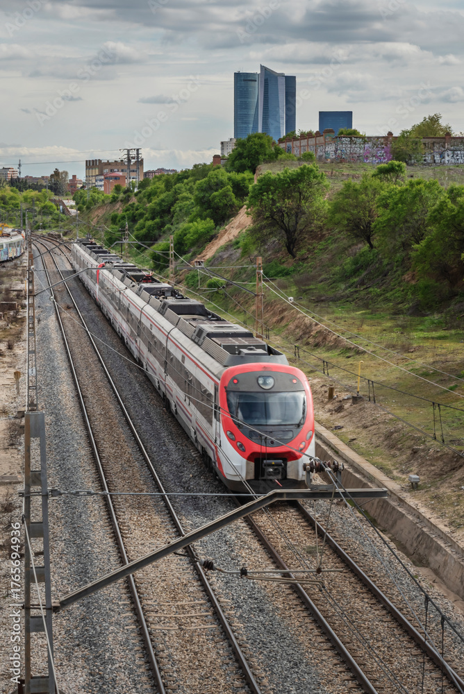 Fototapeta premium Urban track section with side acoustic screens, LED lighting, and controlled vegetation between the two directions of traffic