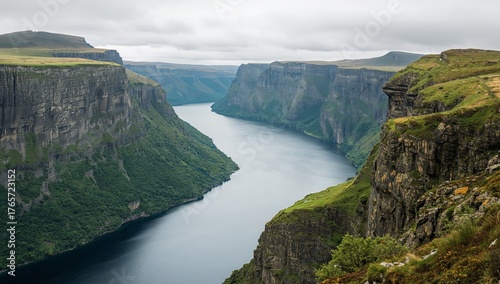Impressive Cliffs and a Serene River Valley, Landscape of Majestic Proportions.