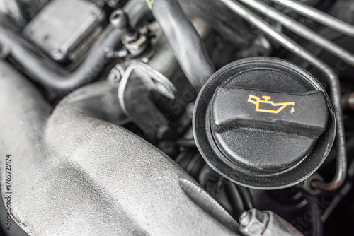 An engine oil cap with the oil symbol on a car engine