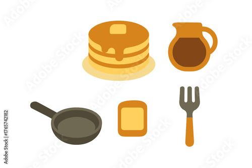 Golden pancakes stack with butter and syrup next to breakfast cooking utensils