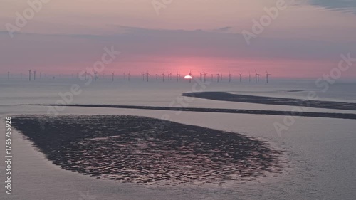 Wind turbines in Liverpool Bay at sunset, New Brighton, Wirral, England