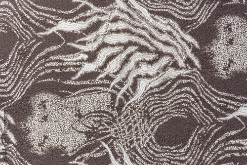 Taupe jacquard fabric texture with metallic lurex and abstract wave pattern, part of textile collection