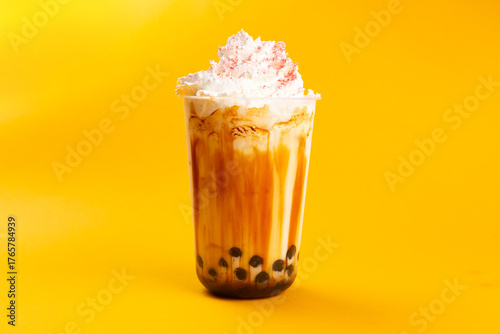 Bubble tea on a yellow background.