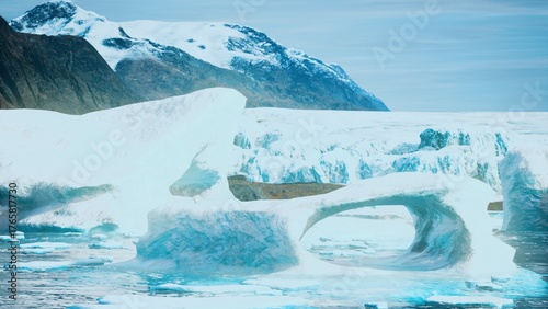 Photos Stunning ice formations float in serene waters, surrounded by jagged mountains under a clear sky