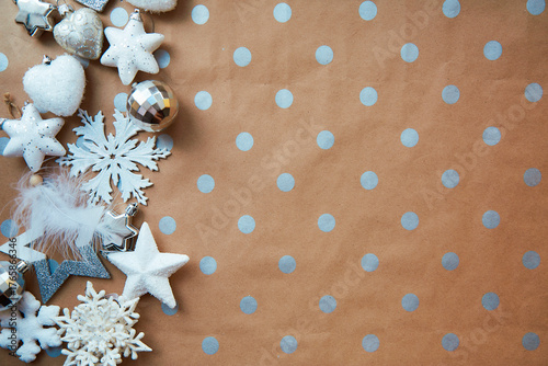 Christmas festive background - basic classic pattern, copy space. Silver and white trendy decorations: disco balls, fluffy Christmas tree toys. Merry Christmas atmosphere and home coziness concept