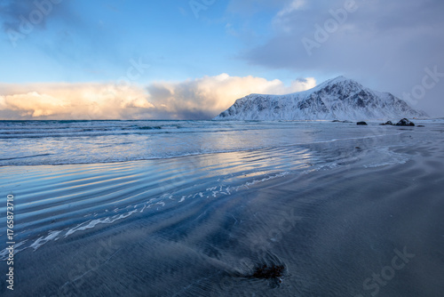 Evening Beach and Snow-Capped Mountains