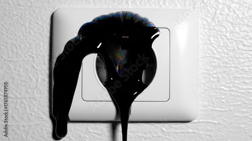 Black liquid dripping from a power outlet, symbolizing electrical hazard or danger.