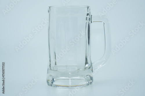 Clear beer glass with handle isolated on white background
