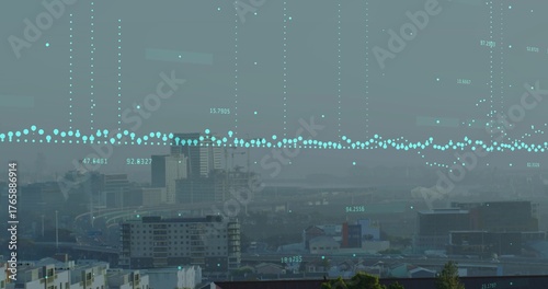 Displaying turquoise data points hovering over apartment blocks and office towers at elevated view